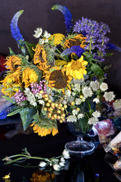 Autumn bouquet of sunflowers in a vase on the table. Lovely bunch of flowers.Soft focus.