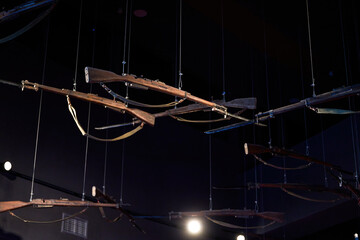 Vintage assault rifle hanging from the ceiling © Steve