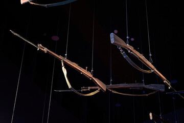 Vintage assault rifle hanging from the ceiling
