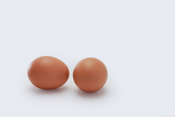 Two chicken egg raw on a white background.