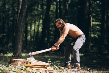 Lumberjack with an axe chopping wood