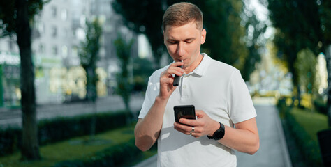 A heat-not-burn tobacco product technology.Man holding in one hand smoking module