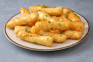 Fried pastry wrapped in cheese in phyllo. Pie in the form of a roll. Turkish name; Kalem borek - sigara boregi