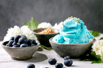 Obraz na płótnie Canvas Turquoise ice cream in waffle cones