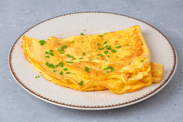 A delicious simple omelet is prepared for breakfast.