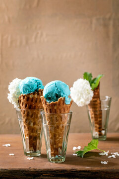 Turquoise ice cream in waffle cones