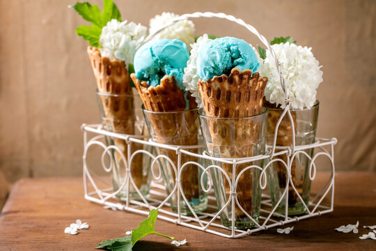 Turquoise ice cream in waffle cones