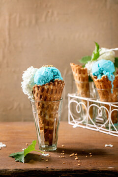Turquoise ice cream in waffle cones