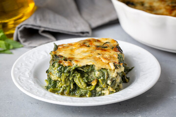 Baked Spinach with cheese delicious Italian food cuisine. Spinach gratin.