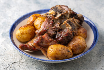 From traditional delicious Turkish food; potato and meat dish in casserole (Turkish name; Guvec tas kebabi, tandir)