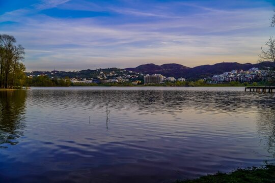 Beautiful View Of A Tranquil Lake With Buildings In The Background During A Scenic Sunset In Tirana