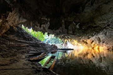 Scenic view of wooden boats in the Konglor Cave in Thakhek loop, Laos