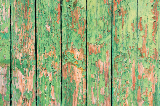 Wood background texture. Wooden surface, old boards, blue-green paint, blank retro template for advertising lettering, rough material, grungy textured background closeup. © velishchuk