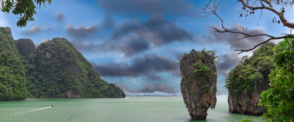 Island Phuket Thailand. Lovely rock in the middle of the ocean surrounded by mountains