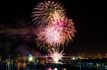 Beautiful night view of colorful fireworks during a holiday over Docklands, Melbourne, Australia