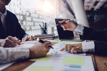 Meeting business team brainstorming number and graph, chart, company financial growth study and analyze marketing strategy planning.