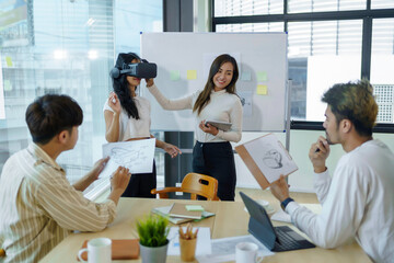 Group of young entrepreneur in Asia used virtual reality glasses during the conference to test the performance of virtual reality headsets and exchange ideas share new knowledge approaches.