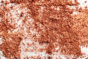 Beige brown eye shadows Scattering on white background. Swatch of compact eyeshadows
