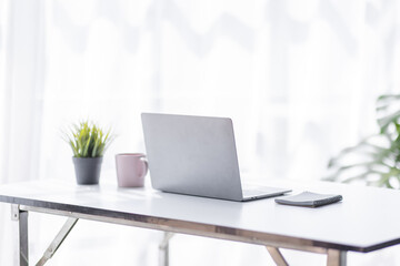 Front view Contemporary business workspace, Workspace Laptop screen, Laptop Computer on office desk. Blurred background.