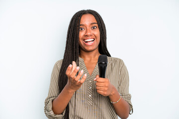 black pretty woman looking desperate, frustrated and stressed. singer with a microphone