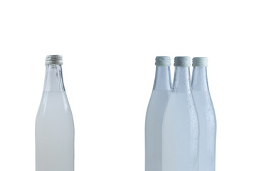 A white bottle with a soda drink on ice isolated.