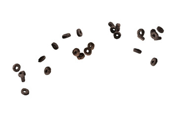 Chocolate rings cereal spill out into a bowl. Breakfast.