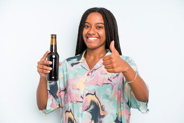 black pretty woman feeling proud,smiling positively with thumbs up beer and holidays concept