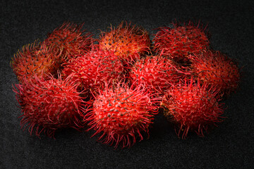 Closeup view of Rambutan fruit on black background