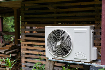 New modern HVAC air conditioning external compressor unit preapred for installation or replacement...