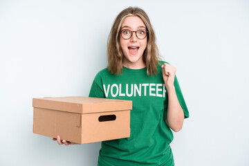 caucasian pretty woman smiling with a happy, confident expression with hand on chin. volunteer and...