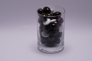 glass filled with pills