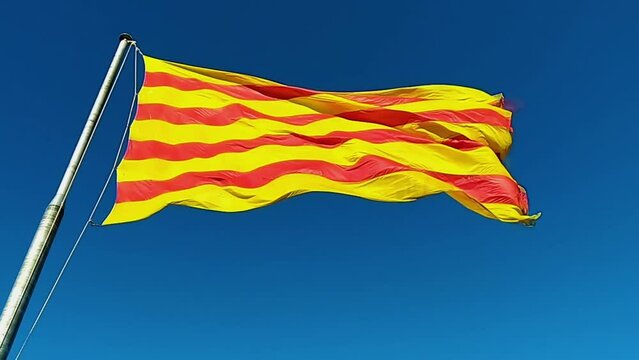 Flag of Catalonia. Sanyor flies over Barcelona