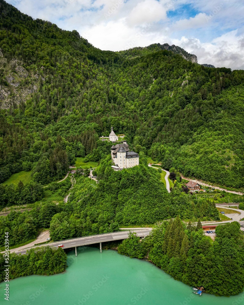 Poster Beautiful view of the majestic Klaus castle on green hilltop, on riverbank, Austria