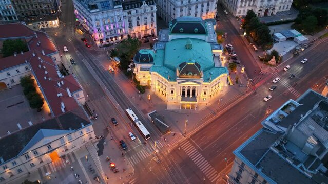 Vienna opera house at night, aerial night view of the capital of Austria, classic Vienna opera theatre with night illumination, downtown Vienna after sunset, tourism in Austria
