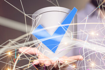 shield protection concept holding in hand