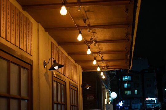 Low Angle Shot Of Exterior Light Bulbs Of A Korean Pub