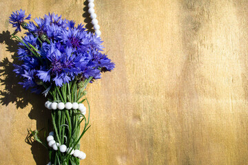 Cornflowers on a wooden background