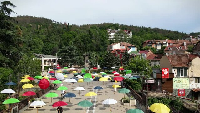 Aerial view of the city square Mite Markov and the bridge with umbrellas in Bulgaria, Blagoevgrad