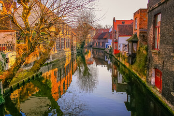Fototapeta na wymiar Peaceful Canal in idyllic Bruges with bridge, Belgium