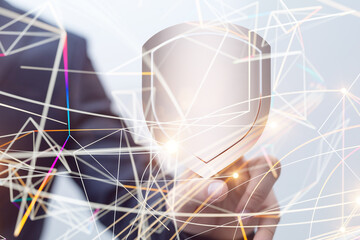 shield protection concept holding in hand