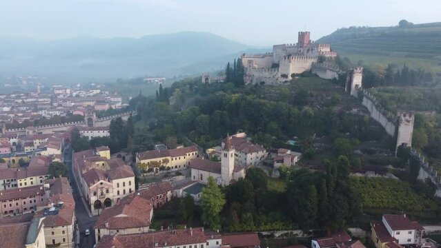 Drone footage over the Veneto castle and cityscape under the blue sky