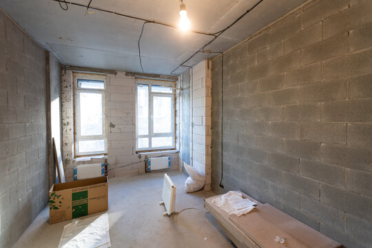 Working process of installing metal frames for plasterboard -drywall - for making gypsum walls in apartment is under construction, remodeling, renovation, extension, restoration and reconstruction