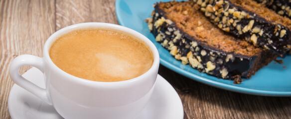 Fresh baked pastry made of zucchini and cup of white coffee. Delicious dessert