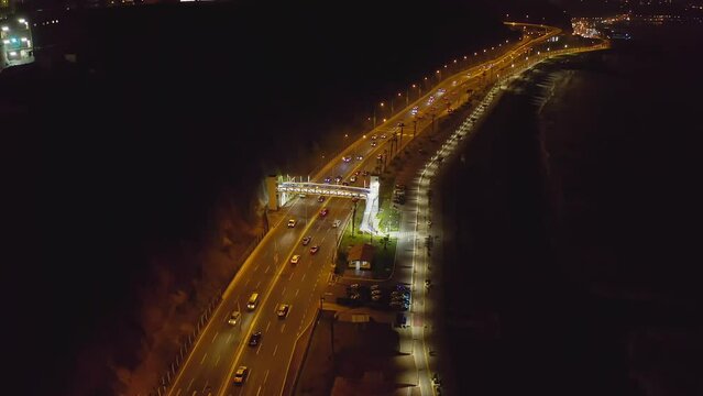 Aerial view of cars driving on the highway at night in Lima, Peru