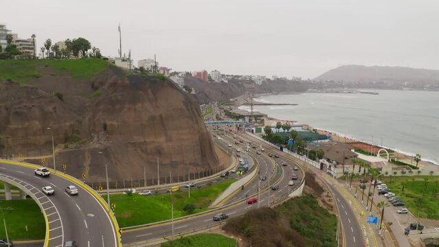 Aerial view of roads with driving cars in Costa Verde, Lima, Peru