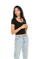Young beautiful woman in loose jeans posing on white background