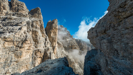 climbing the via ferrata "via delle bocchette" mountain sign in the brenta Dolomites in Italy