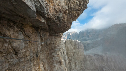 hikers climbing the via ferrata 