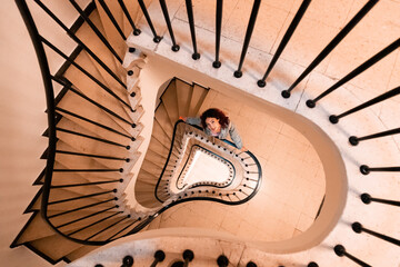 Geometric spiral pattern extending down the architectural elements of the stairs in the house and...