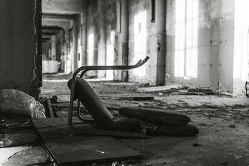 Broken chair in abandoned factory.